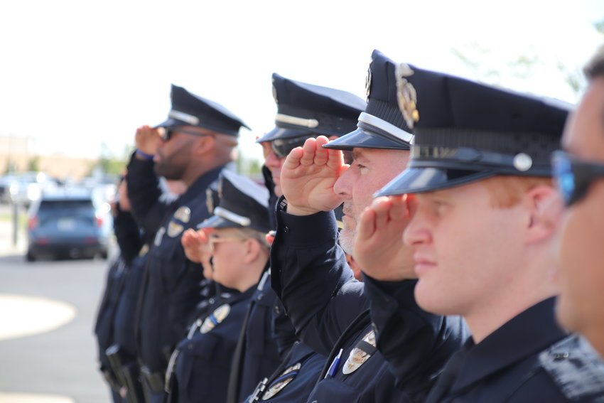 Brighton officers offer a final salute Sept. 29 for Brighton police Cmdr. Frank Acosta.